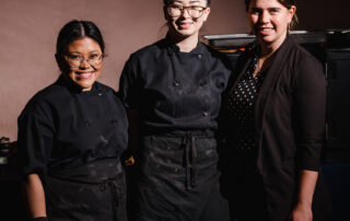 Women Wine and Food Women's Health Clinic Chefs standing together