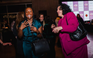 Women Wine and Food Women's Health Clinic women laughing in cute outfits